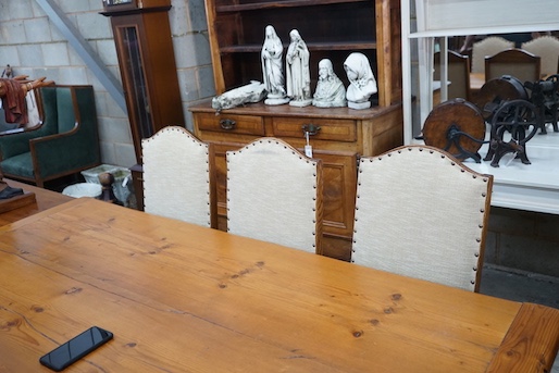 A set of six 18th century style oak dining chairs, with cream upholstered seats and backs